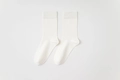 Classic white mid-calf cotton socks with ribbed cuffs and breathable knitted texture - One Size / White