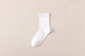 Classic white mid-calf cotton socks with a ribbed cuff and minimalist aesthetic - One Size / White