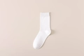 Classic solid white crew length cotton socks for men in minimalist rib-knit design - One Size / White