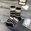 Thick black and white striped wool socks with yellow rolled edges in retro casual style - One Size / Black Heel