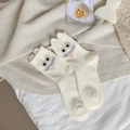 Thick beige camel wool crew socks featuring cute cartoon monster embroidery for winter - Creamy White