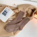 Thick coffee brown ribbed wool socks for women presented in a cozy home setting - One Size / Coffee