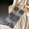 Thick knitted Fair Isle leg warmers in dark grey with white geometric patterns - One Size / Dark Gray