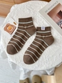 Brown striped cotton mid-calf socks with cute cartoon label on a cozy white tablecloth - One Size / Brown Stripes