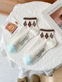 Off-white striped crew socks with kitten text and brown diamond pattern detail - One Size / Ribbed Diamond Pattern (KITTEN)