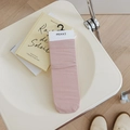 Mid-calf cotton socks in dusty pink color on minimalist cream chair and wooden floor - Nude Pink