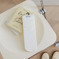 MEKKI white knit mid-calf cotton socks in soft texture presented on a yellow book - White