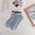 Light blue and grey striped combed cotton crew socks with a minimalist white egg tag - One Size / Blue
