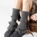 Detailed knit texture of grey ribbed leg warmers featuring warm winter crochet style - One Size / Dark Gray