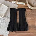 Black knitted leg warmers with ribbed texture and intricate hollow out lace details - One Size / Black