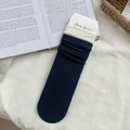Navy blue crew socks with contrasting beige cuffs and classic vertical rib textures - One Size / Dark Blue