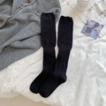 Minimalist Japanese style black vertical striped calf socks displayed on white fabric - One Size / Black