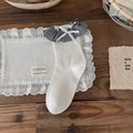 White mid-calf socks with black and white plaid ruffle trim and a silk bow accent - One Size / White