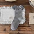 Grey cotton mid-calf socks featuring plaid ruffle trim and a satin ribbon bow detail - One Size / Gray