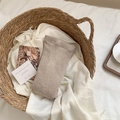 Oatmeal knit ribbed thermal leggings in a cozy home setting inside a woven basket - One Size / Khaki