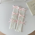 Crèmewitte gebreide beenwarmers met roze satijnen strikken en ribgebreide textuur - Eén maat / Witte Basis Roze Strik