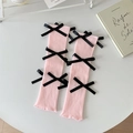 Roze gebreide beenwarmers met zwarte satijnen strikken in balletstijl - Eén maat / Roze met zwarte strikken