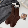Vintage dark brown mid-calf wool socks with white floral lace trim and ribbed texture - Brown