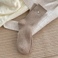 Brown ribbed wool socks with silver metal button detail in a cozy home setting - One Size / Khaki