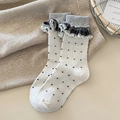 Women's vintage wool socks featuring white fabric with black polka dots and lace trim - White