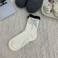 Cream knit socks with black frill edge and blue ribbon bow in flat lay style - Double Layer Bow Style