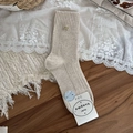 Beige ribbed knit mid-calf socks featuring a delicate gold bow accent on the cuff - One Size / Khaki