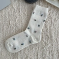Creamy white wool socks with pink and blue floral patterns and elastic ribbed cuffs - One Size / Floral