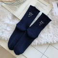 Navy blue wool socks with white letter embroidery on a plush white carpet - One Size / Navy Blue