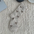 Speckled oatmeal wool socks with dark brown bow patterns on a cozy white plush rug - One Size / All-over Bow Knot Style (RH010)