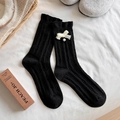 Calcetines de lana negros con lazo de punto blanco y perla sobre tejido acanalado - Negro
