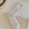 Beige cable-knit wool socks with colorful speckled patterns in a vintage winter style - White