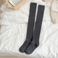 Dark grey cable-knit over-knee socks in a cozy knit texture for a warm winter look - One Size / Dark Gray