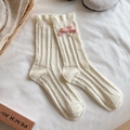 Cream knit mid-calf wool socks featuring pink bows, pearls, and ruffled cuffs - One Size / Off-white