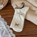 Calze beige a fiori con trama a rombi in rilievo e un piccolo fiocco marrone - Taglia unica / Bianco Sporco Con Fiocco Nero