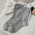 Gray knitted crew socks with black polka dots and ruffle cuffs on a soft background - One Size / Light Gray