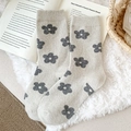 Vintage light gray wool socks with dark floral patterns on a white plush rug - One Size / Off-white