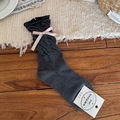 Dark gray knitted calf socks with pink satin bows in a cozy home setting - Dark Gray