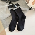 Calze nere a costine con bordo in finta pelliccia grigia e dettaglio bottone blu - Nero