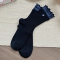 Black ribbed mid-calf socks featuring blue plaid ruffle trim and a floral button detail - Dark Blue