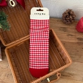 Cozy red and white checkered crew socks with scalloped edges in festive winter setting - One Size / Plaid