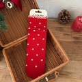 Festive red crew socks with white floral patterns and ruffled edges in a gift basket - One Size / Red Floral