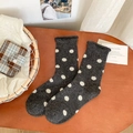 Vintage dark grey wool socks with white polka dots shown on a warm wooden background - One Size / Dark Gray