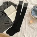 Knee-high cable knit socks in black and dark grey color-block design for winter warmth - One Size / Black & Dark Gray Patchwork