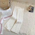 Cream white knitted leg warmers with vertical ribs and decorative side buttons - One Size / White