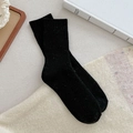 Calze di lana nera a coste per donna con una spessa trama a maglia termica in tinta unita - Taglia unica / Nero