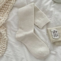 Creamy white mid-calf knit socks with vintage brand label for autumn and winter warmth - One Size / White