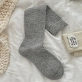 Thick marl grey knit calf socks with ribbed cuffs on minimalist white bedding - One Size / Light Gray