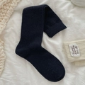 Classic solid black calf socks with ribbed cuffs in a folded minimalist display - One Size / Navy Blue