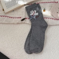 Grey knitted bear socks with blue plaid bow and embroidery in a cozy setting - One Size / Gray
