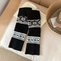 Black Fair Isle knit leg warmers with white snowflake patterns and ribbed cuffs - One Size / Black
